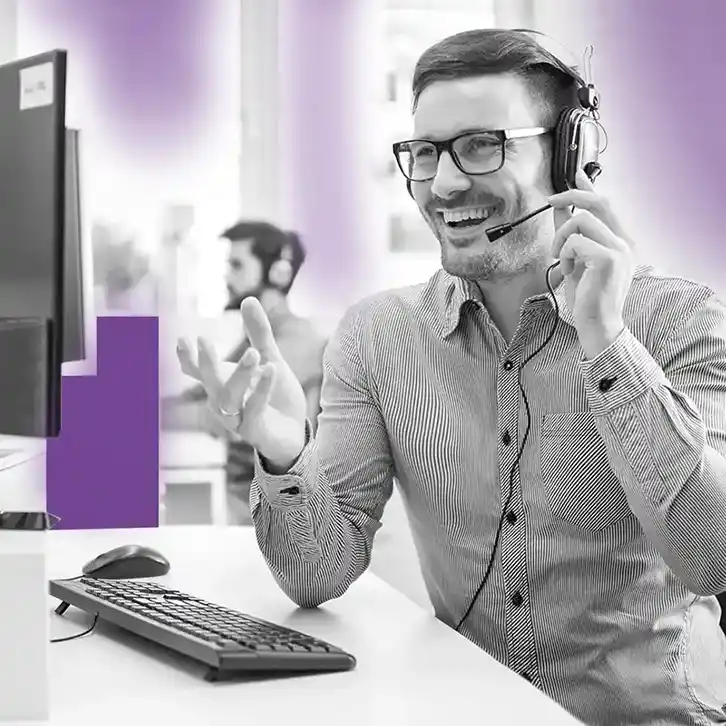 Employee having a phone conversation with headset on
